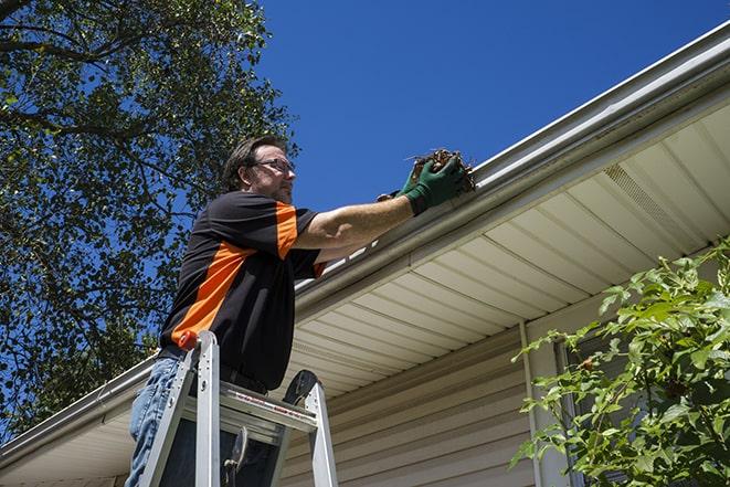 handyman installing a new gutter system in Kirkwood MO
